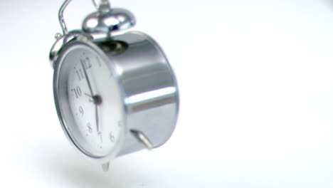 Alarm-clock-falling-down-in-super-slow-motion