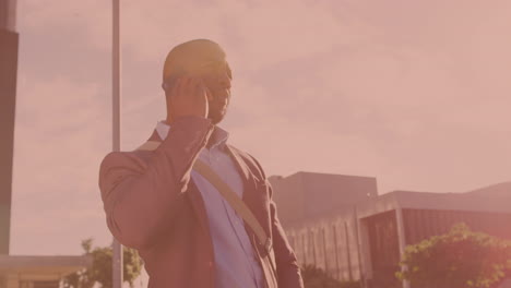 african american senior businessman talking on the smartphone on the street