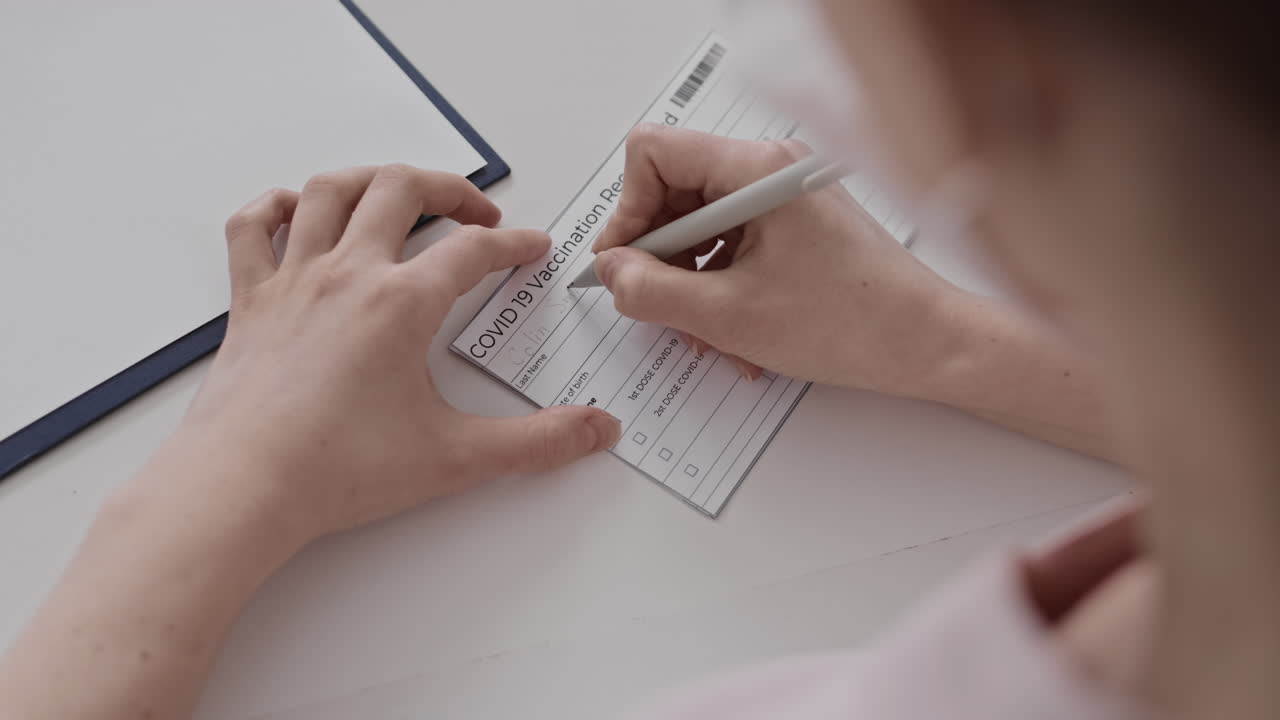 Filling in Covid-19 Vaccination Record Card