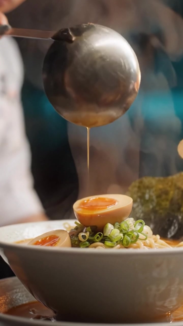 A Delicious Bowl of Noodles with Soft Boiled Eggs and Green Onions Steaming Hot, Showcasing Culinary Artistry and Flavors in Every Bite