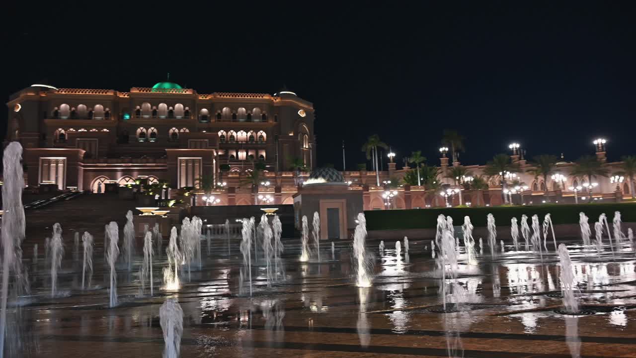 Emirates Palace Hotel lights up the Abu Dhabi skyline at night in the UAE