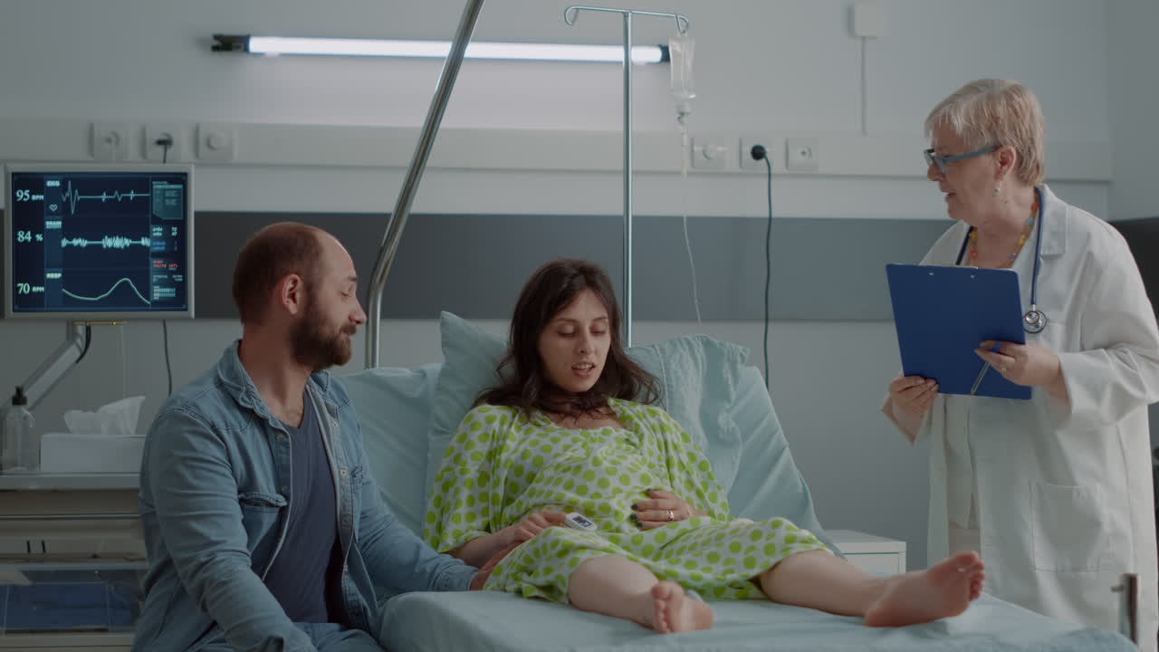 Young pregnant adult getting support from doctor