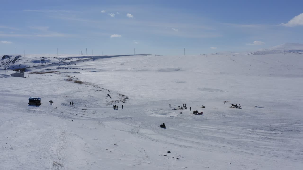 Snow mobile on frozen cildid lake in Turkey on white landscape