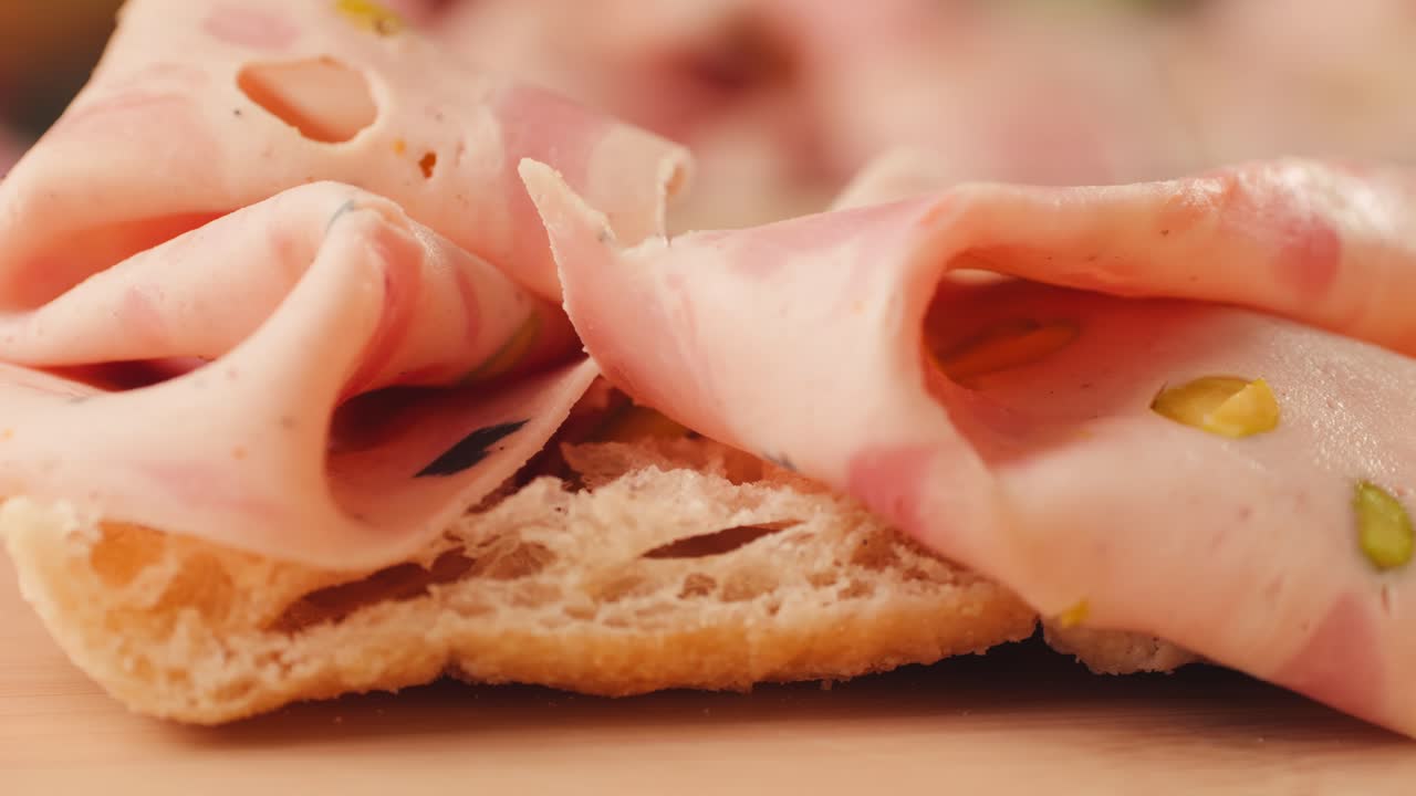 Close-up of sliced salami on bread