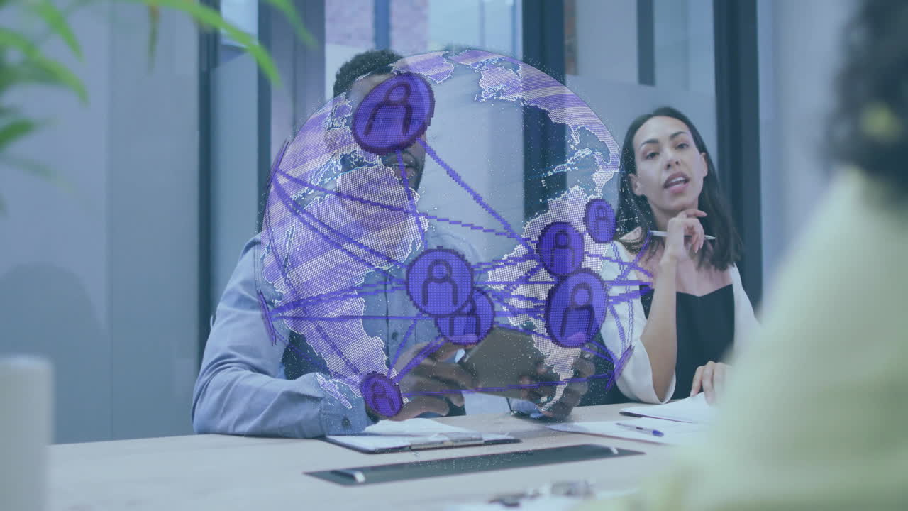 Colleagues discussing tech ideas with tablet and pen in office showing holographic globe network