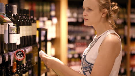 woman shopping for alcohol in a bottle store