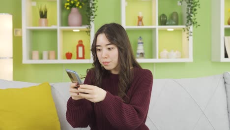 Asian-young-woman-not-using-mobile-app-on-phone.