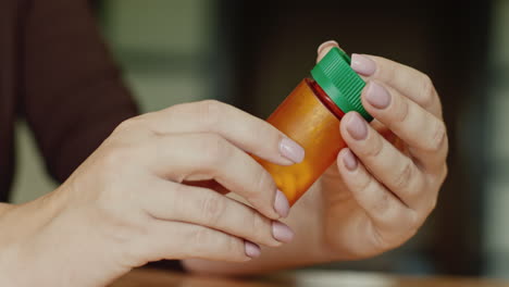 a woman holds a jar of medicine