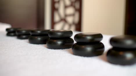 detail view of hot stones on a massage table