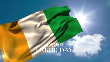 Animation-of-happy-labor-day-text-over-flag-of-ivory-coast-and-blue-sky