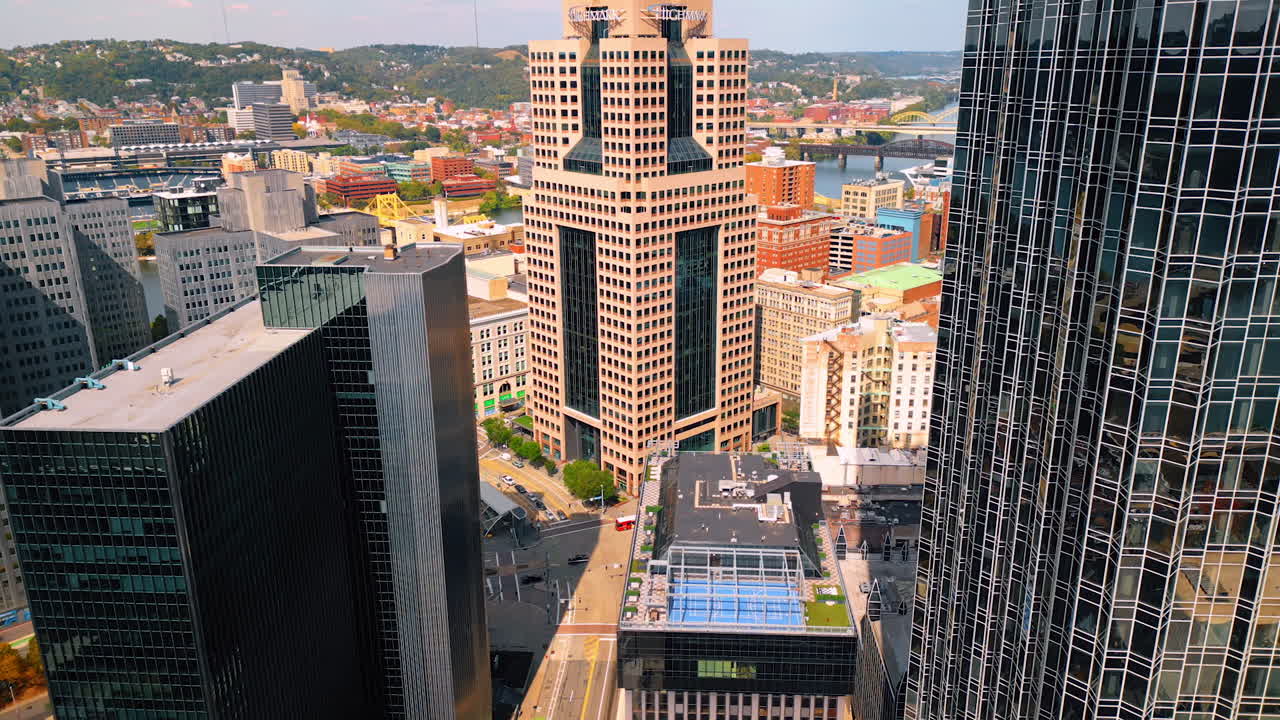 Empty wide-lane street in the downtown of Pittsburgh, Pennsylvania, USA. Drone footage at the façade of One PPG Place skyscraper