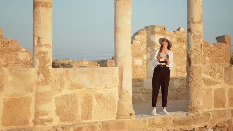 woman exploring ancient ruins