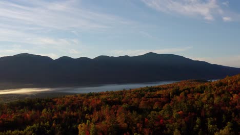 beautiful fall leaf colors and foliage during dawn sunrise in new england mountains