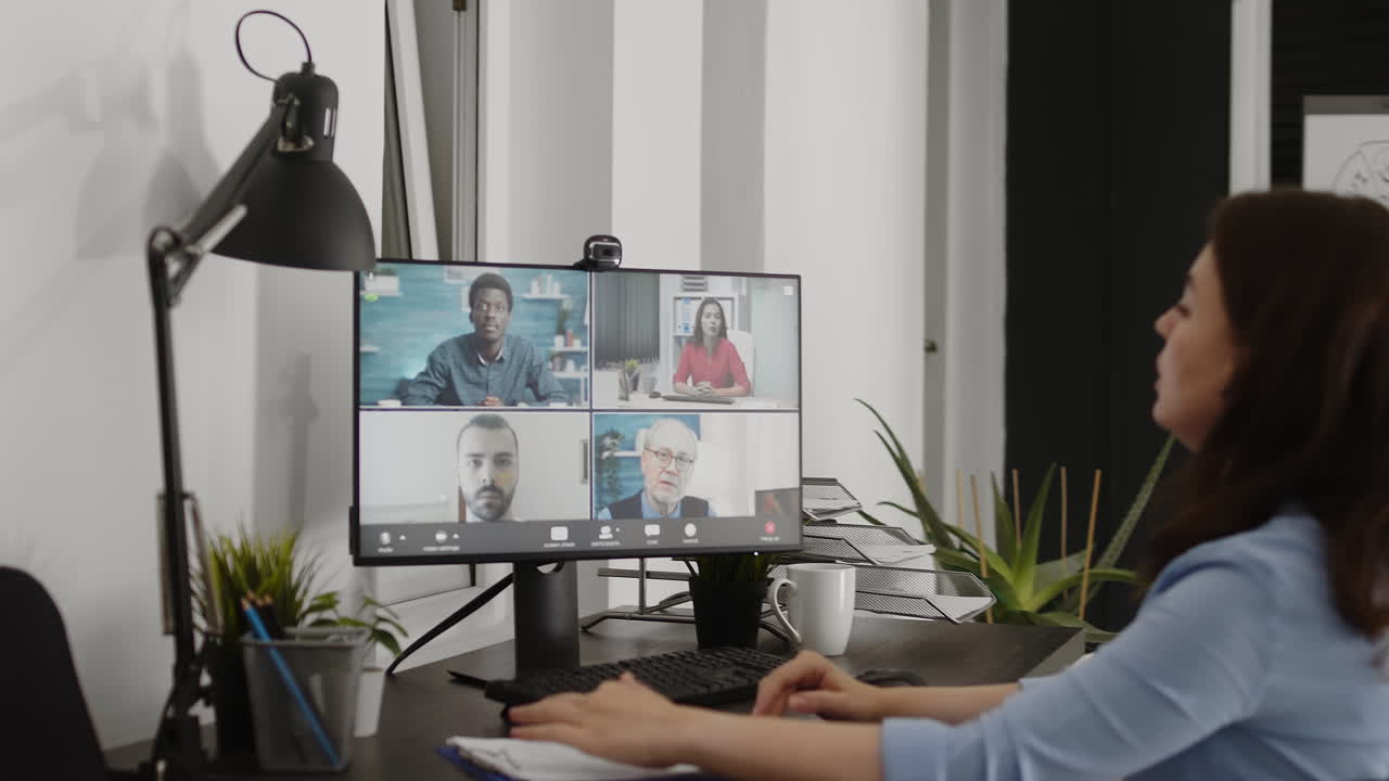 Woman in office participating in a video conference call