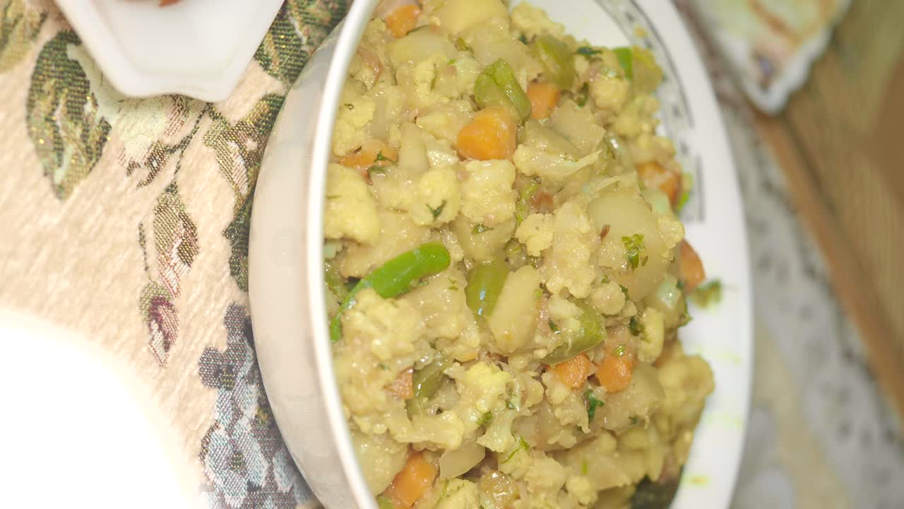 Close-up of a bowl of mixed vegetable curry