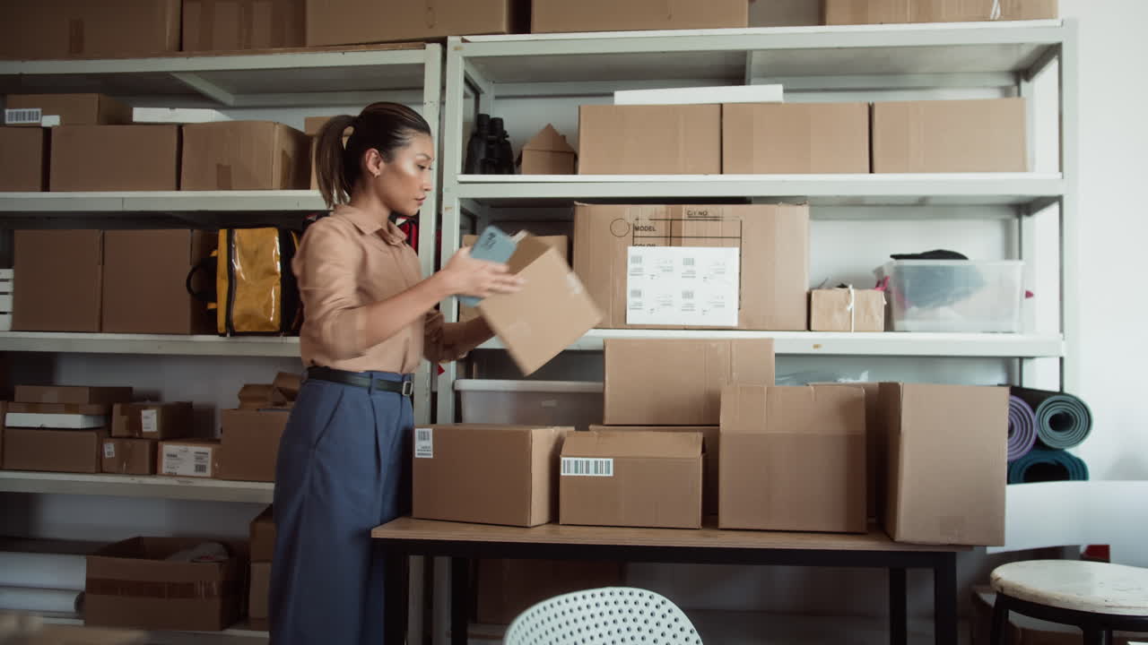 Storage Office Manager Using Phone when Working with Parcels