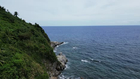 rocky coastline of an island and blue sea in the philippines