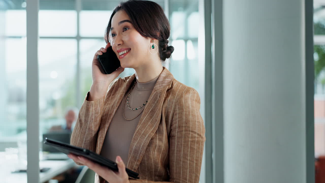 Businesswoman on phone call with tablet in office