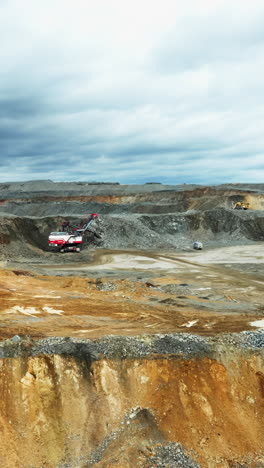 large open-pit mining operation with heavy machinery