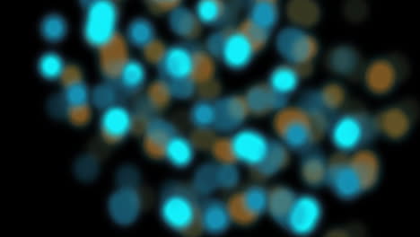 animación de manchas de luz naranja y azul desenfocadas parpadeantes sobre un fondo negro