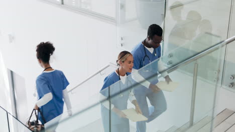 talking, busy and doctors walking in hospital