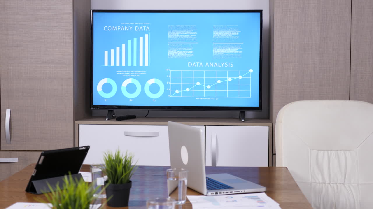 Office with TV showing data