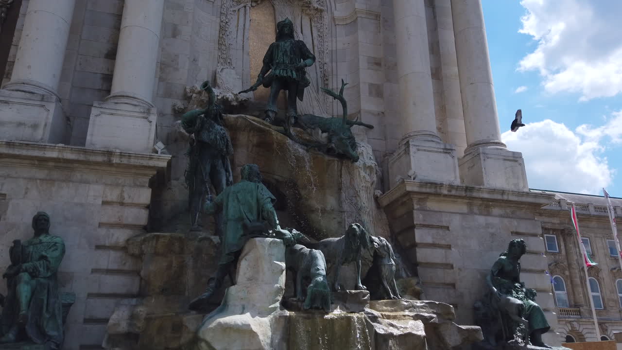 4K Statue and fountain that represents people hunting a big deer. Footage from left to right in a stabilised motion.