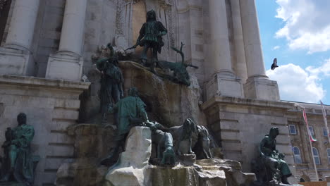 4k statue and fountain that represents people hunting a big deer. footage from left to right in a stabilised motion.