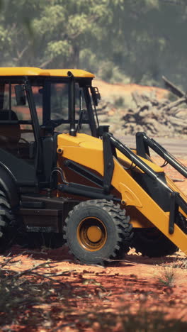 yellow backhoe on a construction site