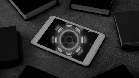 Black and white animation of blue circular scanner processing data on screen of smartphone on desk
