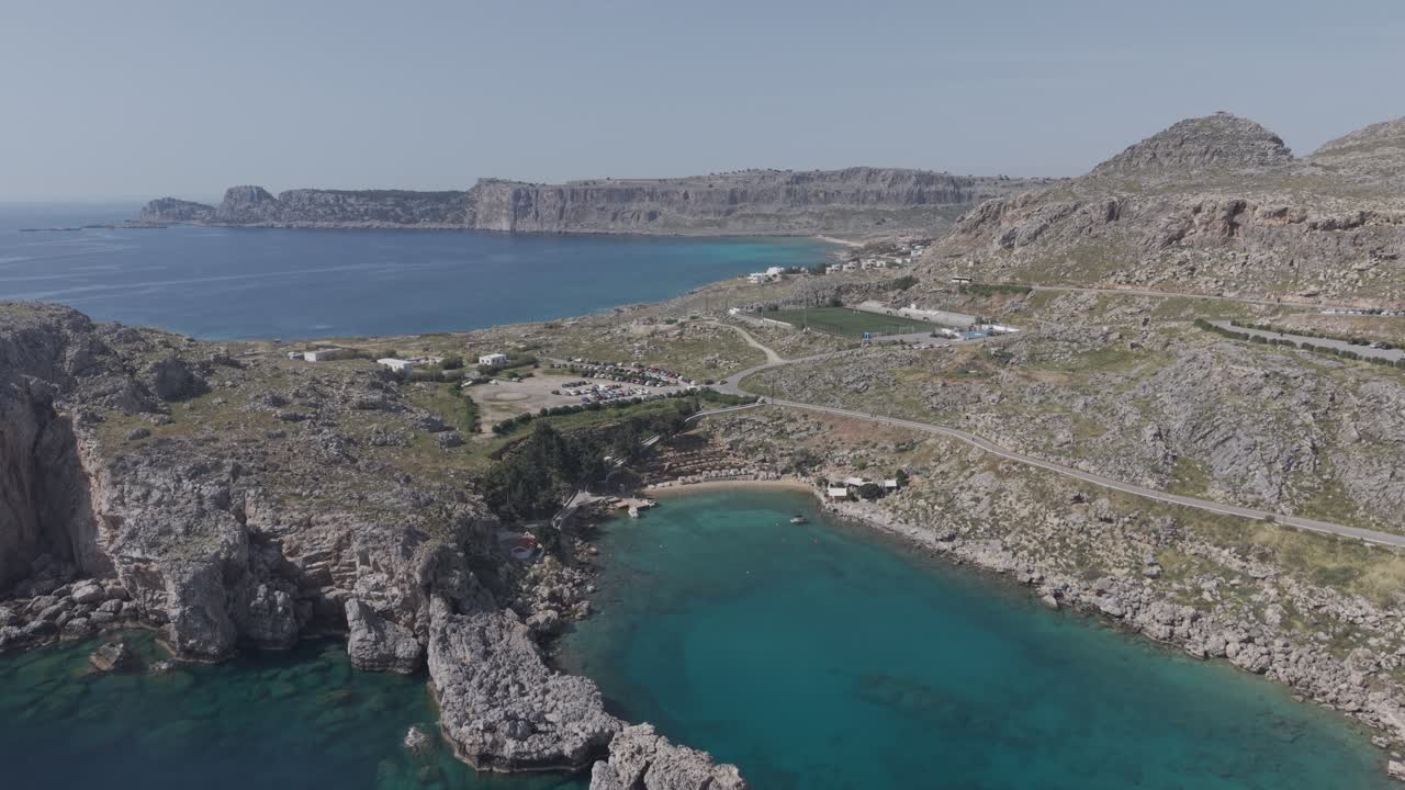 Drone flies towards Saint Paul's bay in Lindos, Rhodes, Greece. 4k filmed in D-Log M profile, not graded.