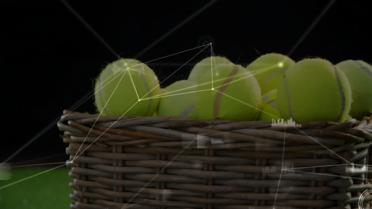 Wicker basket holding tennis balls and showing glowing digital network overlay on green turf