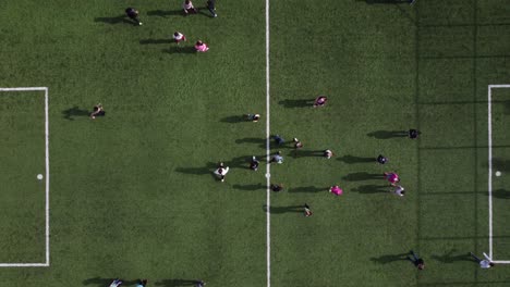 kids playing green soccer field