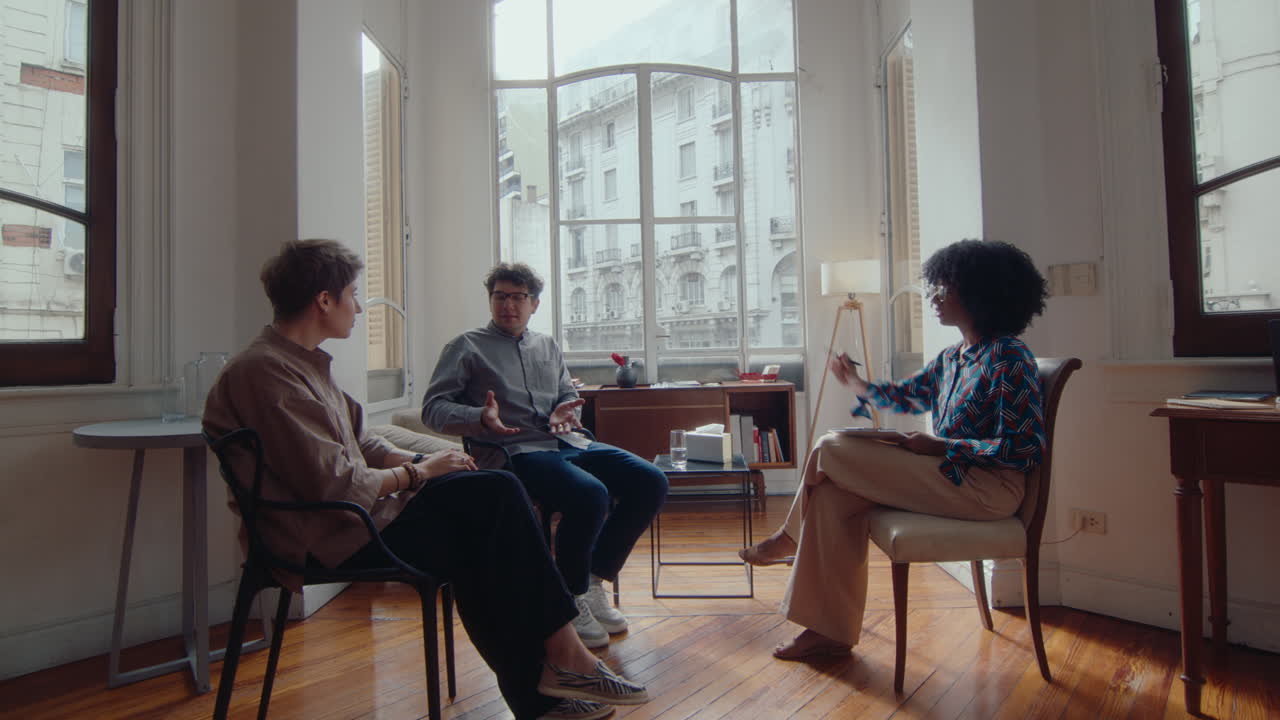 Family Couple Arguing on Therapy Session with Female Psychologist