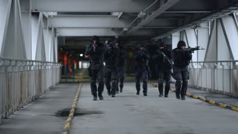 SWAT-officers-with-modern-rifles-protecting-urban-building-from-terrorists