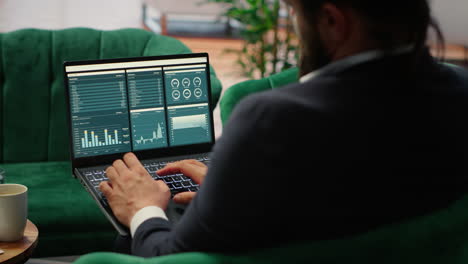 vertical video determined ceo works in office analyzing infographics and setting business goals