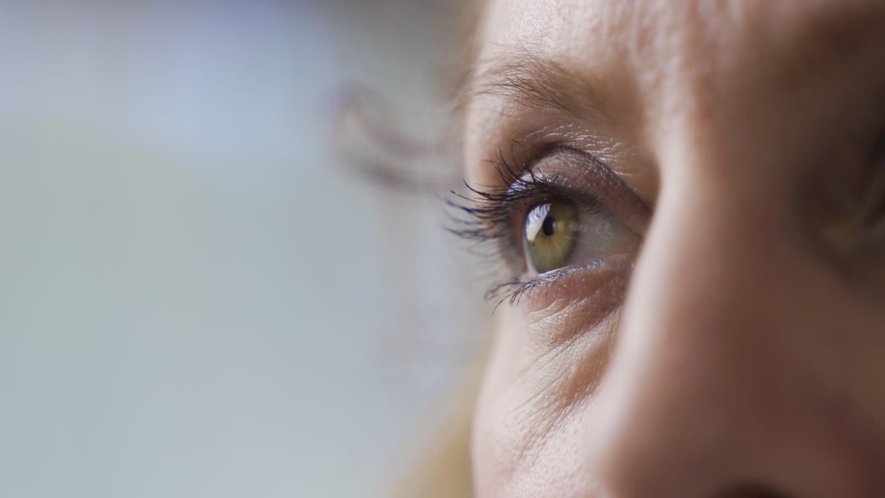 Colorful eyes of mature woman in close-up.