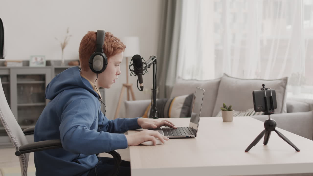 Teenage boy streaming from home