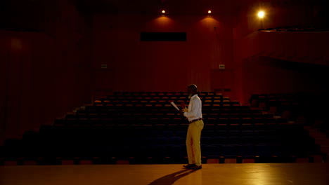 senior african american businessman practicing speech in empty auditorium 4k