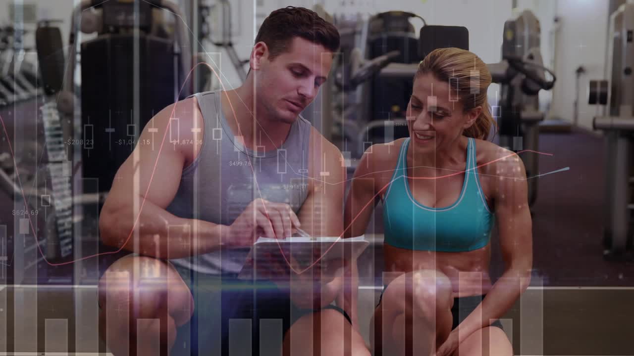 Male trainer tapping tablet and explaining workout plan in gym, animated bars overlaying scene
