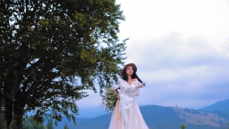 bride in luxury dress posing outdoors. beautiful bride in wedding dress posing on the mountains