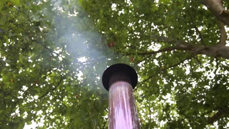 Wood-fired-Hot-Tub-Smoke-Rising-From-Metal-Smokestack-Outdoor