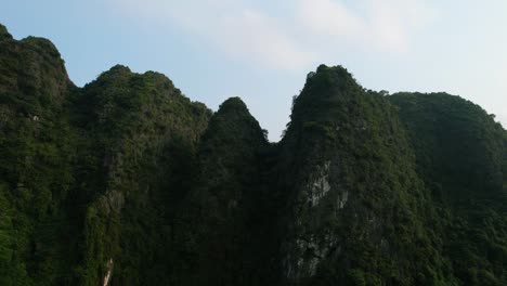 Towering-Limestone-Karsts-or-Ridges-in-Ninh-Binh-Vietnam-at-Sunset---Aerial-Orbiting