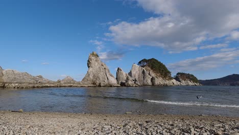 wide open timelapse of rocks at jodagahama beach in japan