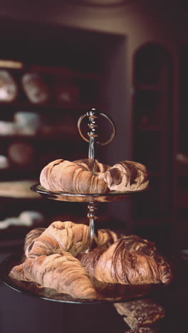 fresh croissants on display in a bakery