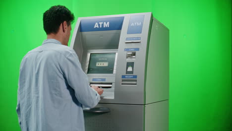person using an atm machine