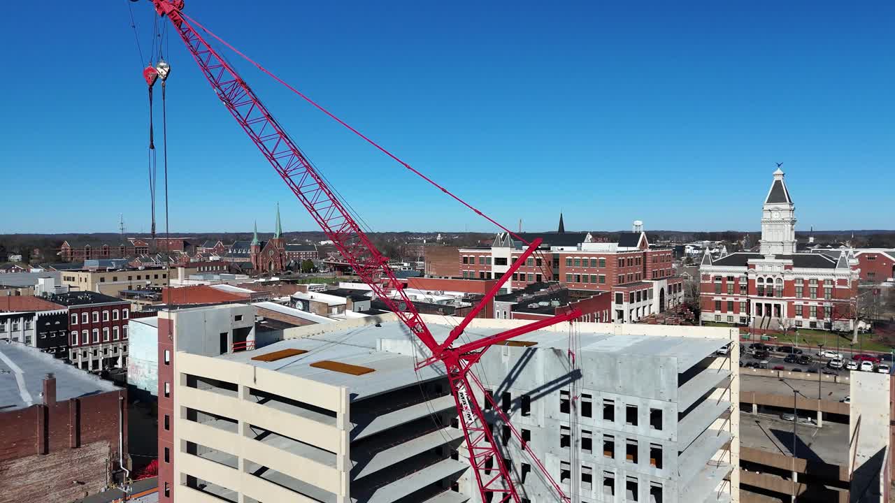 Flying toward and through a crane, revealing downtown Clarksville Tennessee