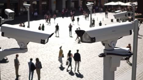 surveillance cameras overlooking a busy public space: monitoring foot traffic and activity in a vibrant urban environment with people and architecture