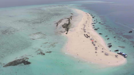 amazing aerial shot of nakupenda island, sandbank atoll in the ocean,clear water, white sand, boats, yachts, blue sea during low tide at sunny summer day in zanzibar.tanzania