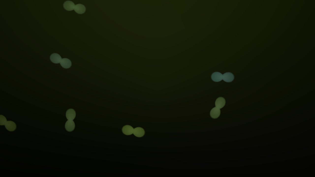 Abstract Green Glowing Particles Floating in Dark Space
